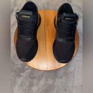 Black and gold mens adidas sneakers